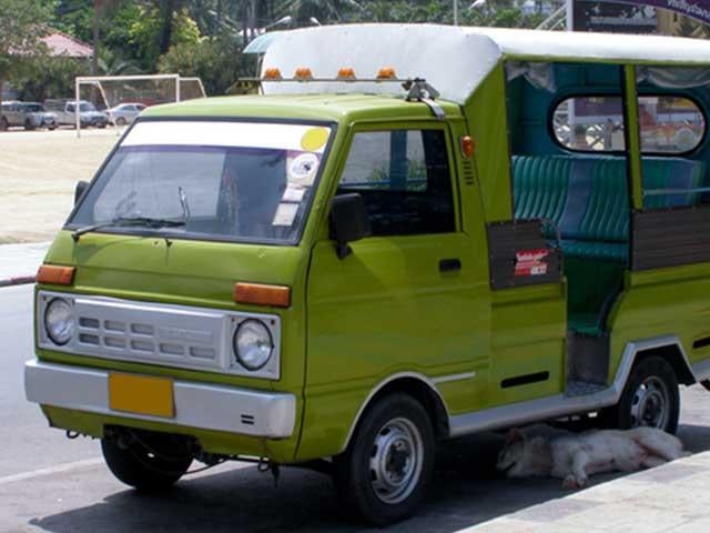 front of green foreign minitruck