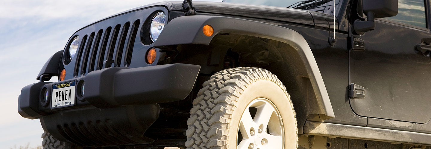 black jeep with "RENEW" Nebraska license plate