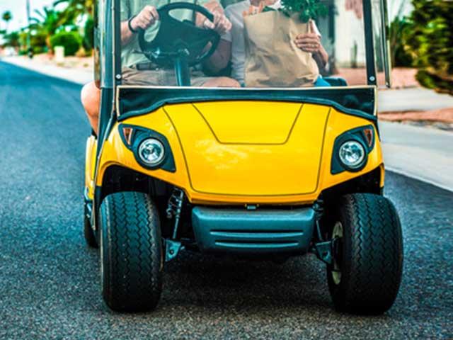 front of yellow golf cart style vehicle